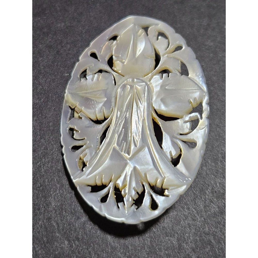 Vintage mother of pearl carved brooch